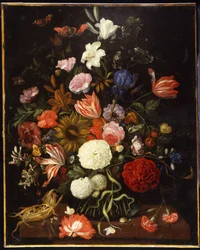 Poppies, tulips, roses, carnations, snowball, lilies, iris, a sunflower and other flowers in a glass vase with a corncob on a ledge