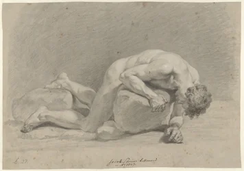 Male nude, lying face down on a rock