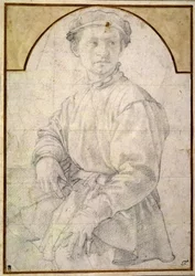 A seated youth wearing a cap