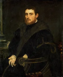 Young man with a red beard in an armchair