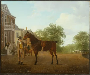 A Gentleman Holding a Saddled Horse in a Street by a Canal