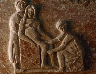 A relief from the tomb of a Roman man and wife shows a woman giving birth. Museo A...