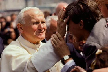 Pope John Paul II blesses a young man, St. Peter