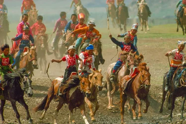 Youngsters in a horse race at a summer festival held near Ulaanbaatar