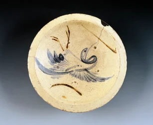Enamel stoneware plate used by nishin-zara sellers (stewed herring) decorated with crane figures dancing between willow branches