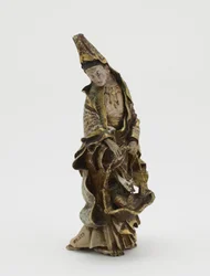 Figure of Kannon holding a fish in a basket, Meiji era