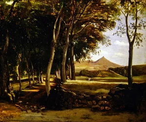 Mountain landscape seen through an avenue of trees