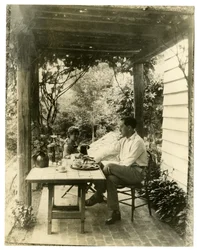 Couple seated in garden, c.1905-40