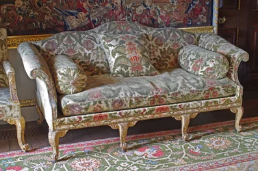 A George III Giltwood Humpback soda-bedstead