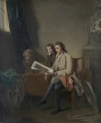 Portrait of a Man and a Boy looking at Prints