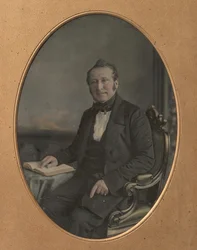 Seated Man Pointing to a Passage in an Open Book
