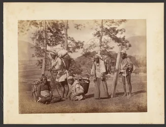 [Group of men carrying baskets]