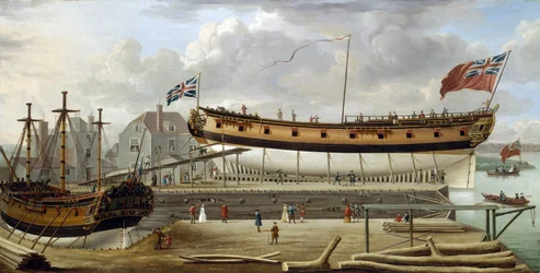 A sixth-rate ship (sixth rate), a British Royal Navy warship, in dry dock, the shipyard is probably that of Rotherhite, on the south bank of the Thames (England)
