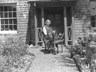 Spinner with Spinning Wheel at Tilberthwaite