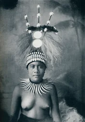 A Samoan woman wearing a collar of cachalots teeth and a ceremonial headdress