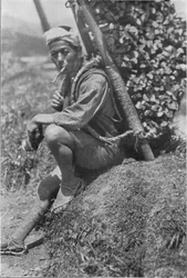 Middle-aged coolie hurriedly seated himself on the bank to pass us in review, c1900