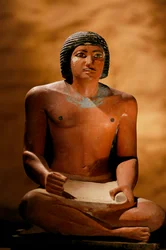 Painted limestone statue of a seated scribe, Old Kingdom, 2002 (photo)