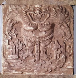 Korean art: gray terracotta brick depicting a monster. Kingdom of Baekje (also Paekche or Paikchei), Korea. 7th century. National Museum of Korea