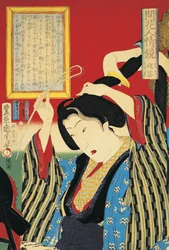 Close-up of a woman looking in mirror