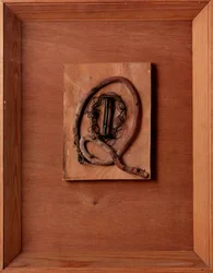 Untitled Composition with film reel and wire by Kurt Schwitters