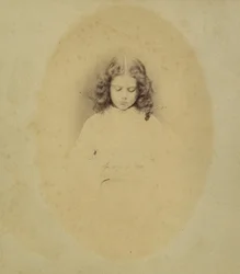 Edith Liddell Seated Beside a Vase of Foxgloves