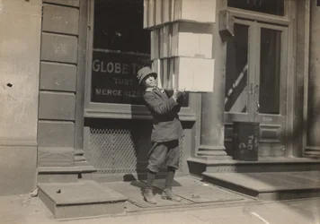 Wagon boy or "tail boy" helping to load the wagon