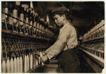 A Doffer Replaces Full Bobbins at Globe Cotton Mill, Augusta, Georgia