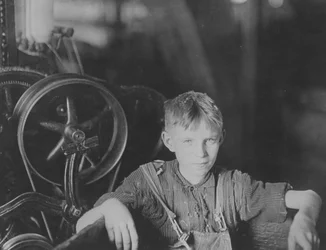A young Polish spinner in the Quidwick Co. Mill