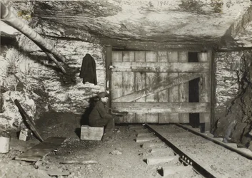 Boy Waiting for Coal to Come Through