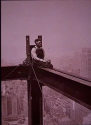 Empire State Building under construction, showing workman taking a break