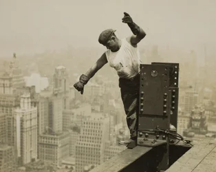 Worker Giving High-Signal to the Derrick Crew