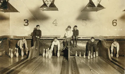 Young Boys Setting Up Bowling Pins at Arcade Bowling Alley Late at Night, Trenton, New Jersey, USA