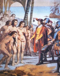 Christopher Columbus lands in the New World in 1492 and is greeted by Taíno Indians