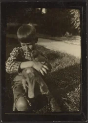 Boy Holding Small Animal