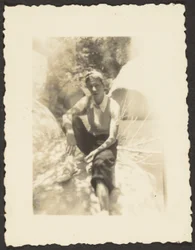[Boy Seated in Shadows]