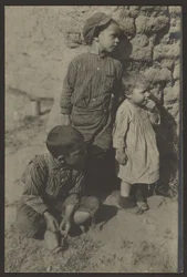 Children Against Stone Wall
