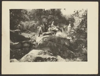 Figures Passing Through Landscape