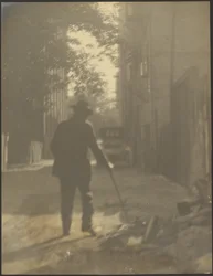 Man Walking Down a Street