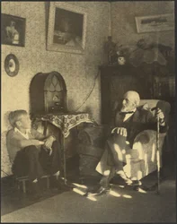 Man and Boy Seated in a Study