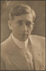 [Man in Light Suit]