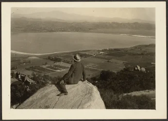 [Man on Rock Promontory Overlooking Farmland]