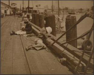 Men Seated on Dock