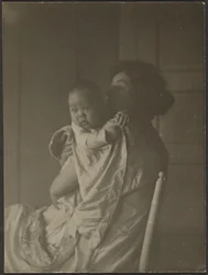 Mother Holding Baby in Chair