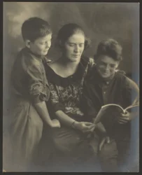 [Mother and Sons with Book]