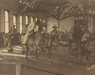 People Riding on a Carousel