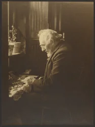 Portrait of a Man Working at Desk