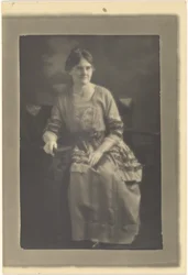 Portrait of a Seated Woman in Dress with Ribbon Accents