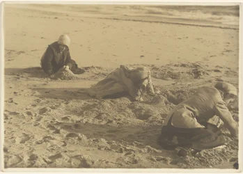 Three Girls Making Sandcastles in the Winter