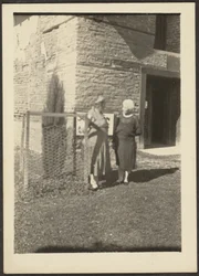 Two Women before Building