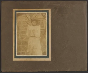 Woman Holding Flower in Garden